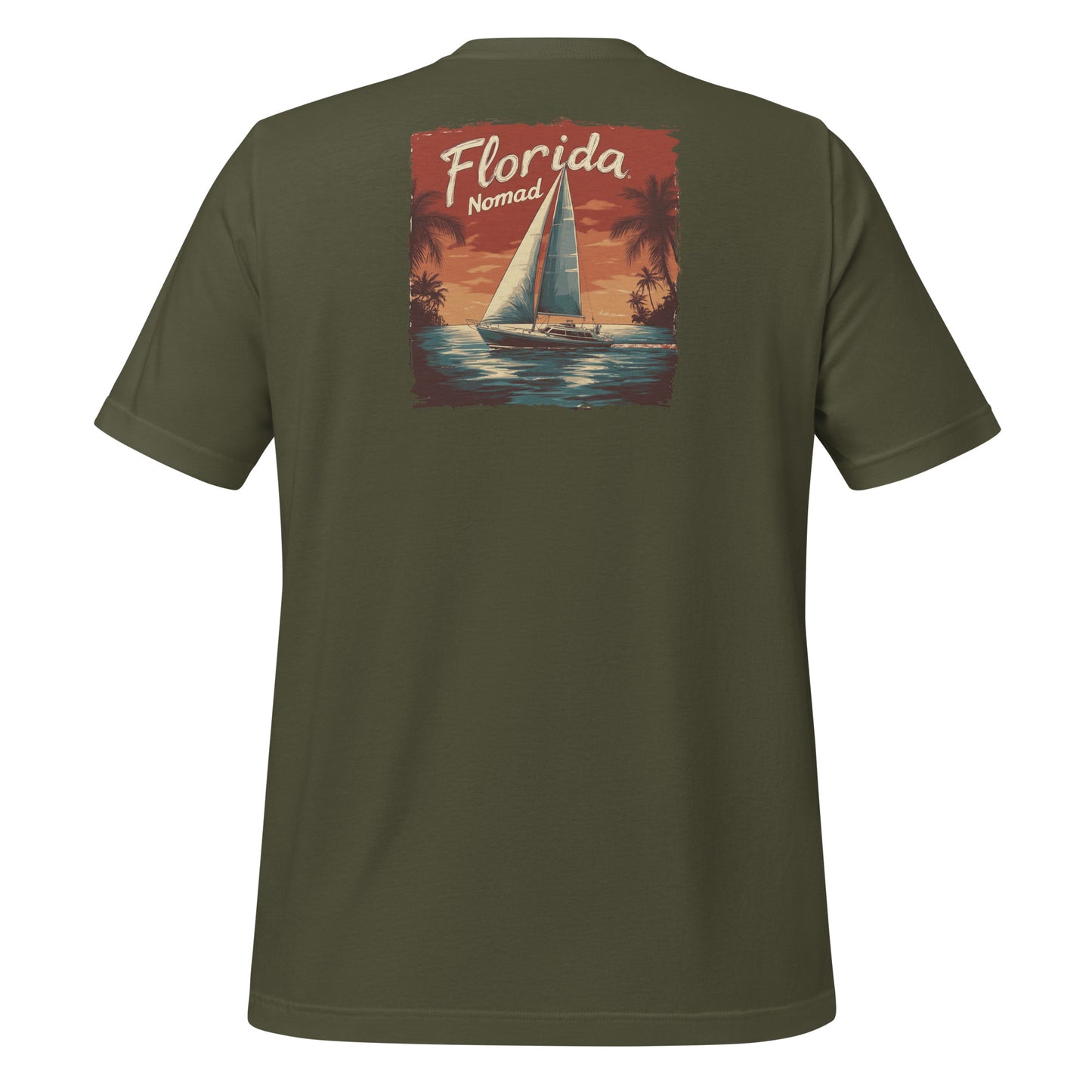 Green Florida Nomad t-shirt with a vintage sailboat design at sunset, reflecting tropical coastal vibes and ocean adventure.